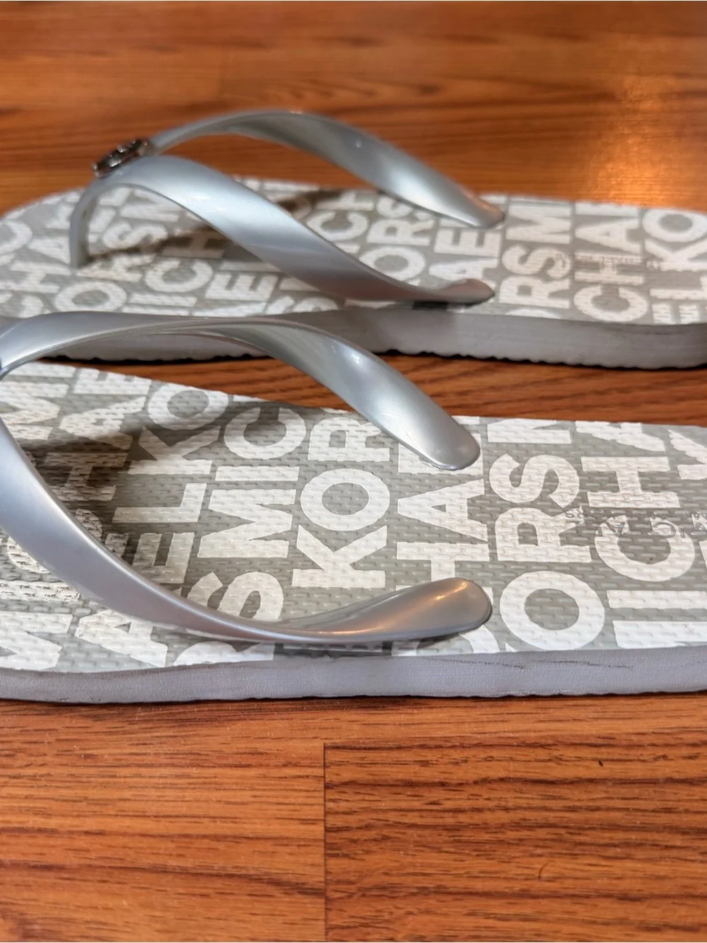 Michael Kors Silver Logo Print Flip Flops Women’s 9